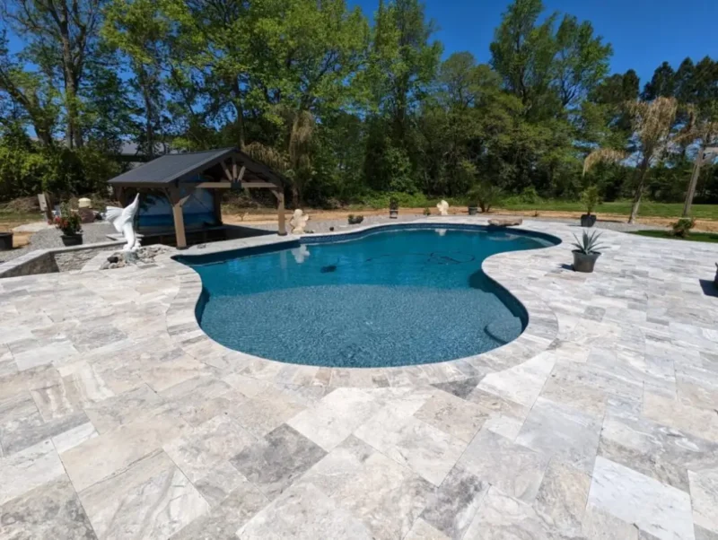 A custom sunken pool with a poolside bar by Coastal Pools in Maryland & Delaware