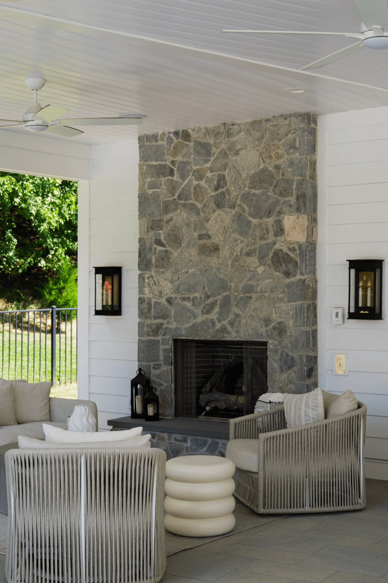 interior of pool house featuring outdoor fireplace